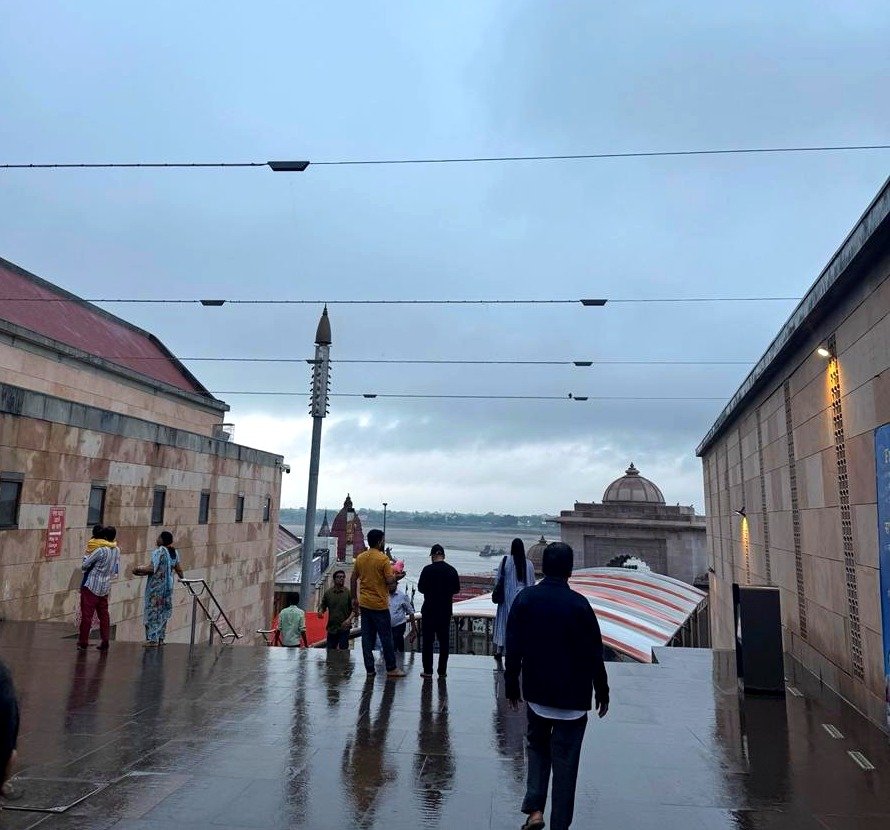 Walking toward the river near the temple corridor in Varanasi